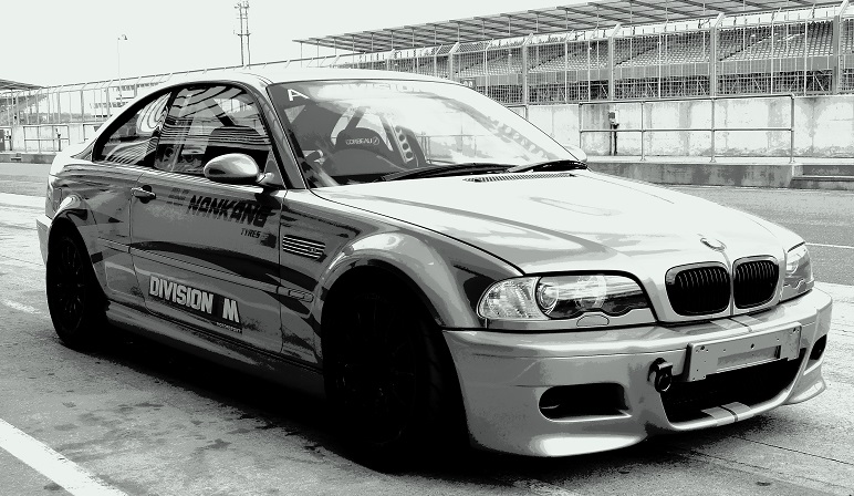 black & white image of a race prepared BMW M5